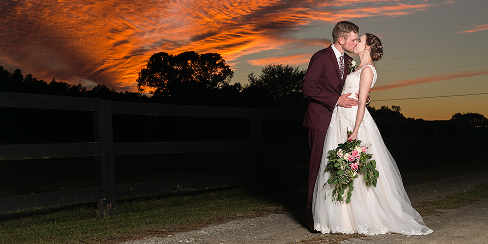 sunset wedding kiss