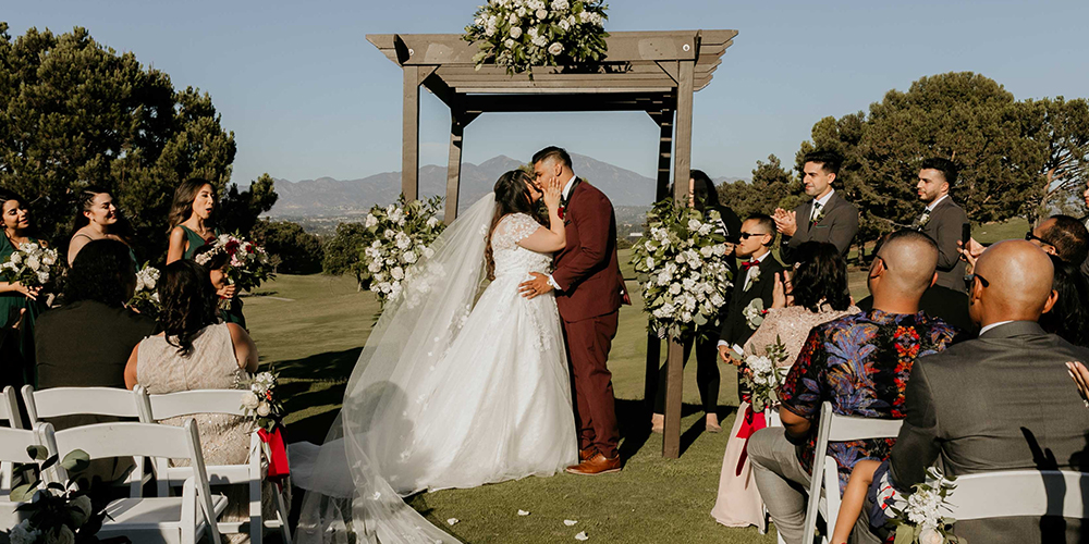 wedding kiss as Mr and Mrs