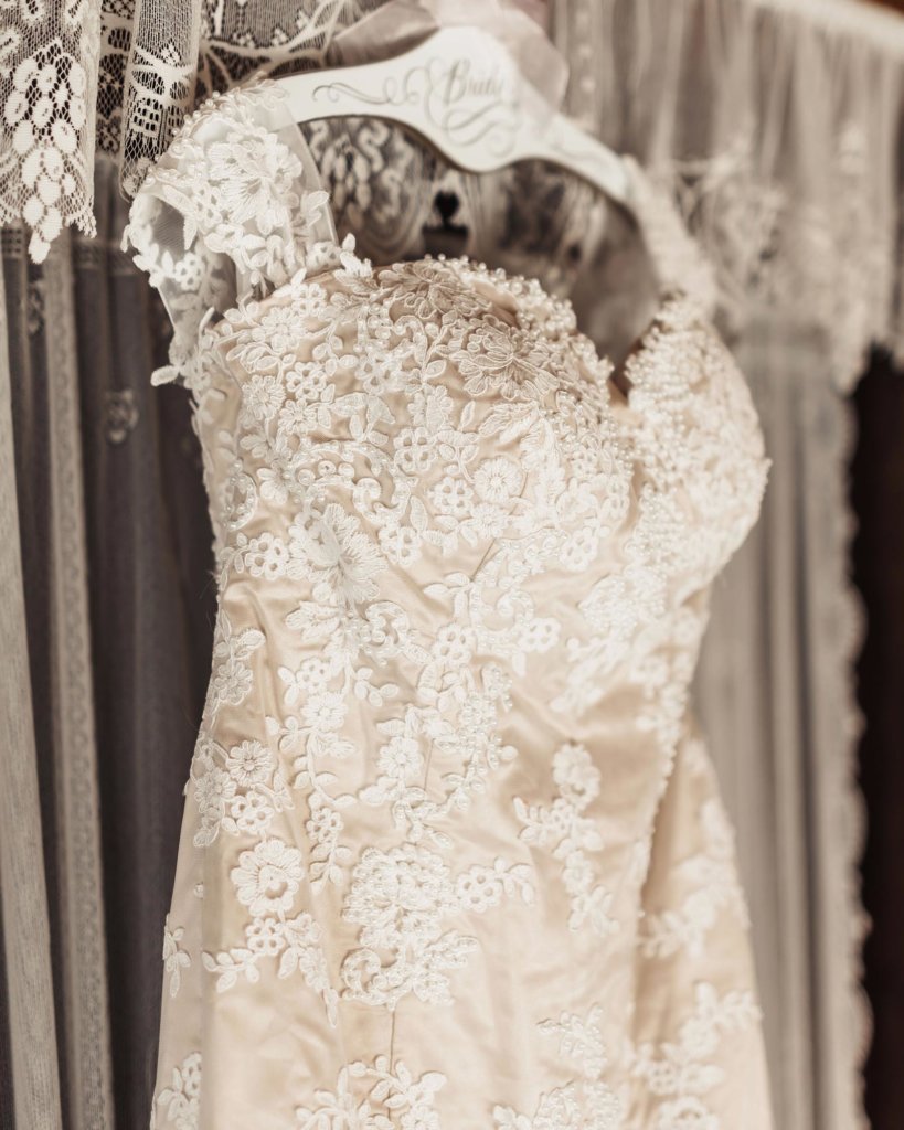 The details of the lace and pearls all throughout the dress made it look elegant and romantic.