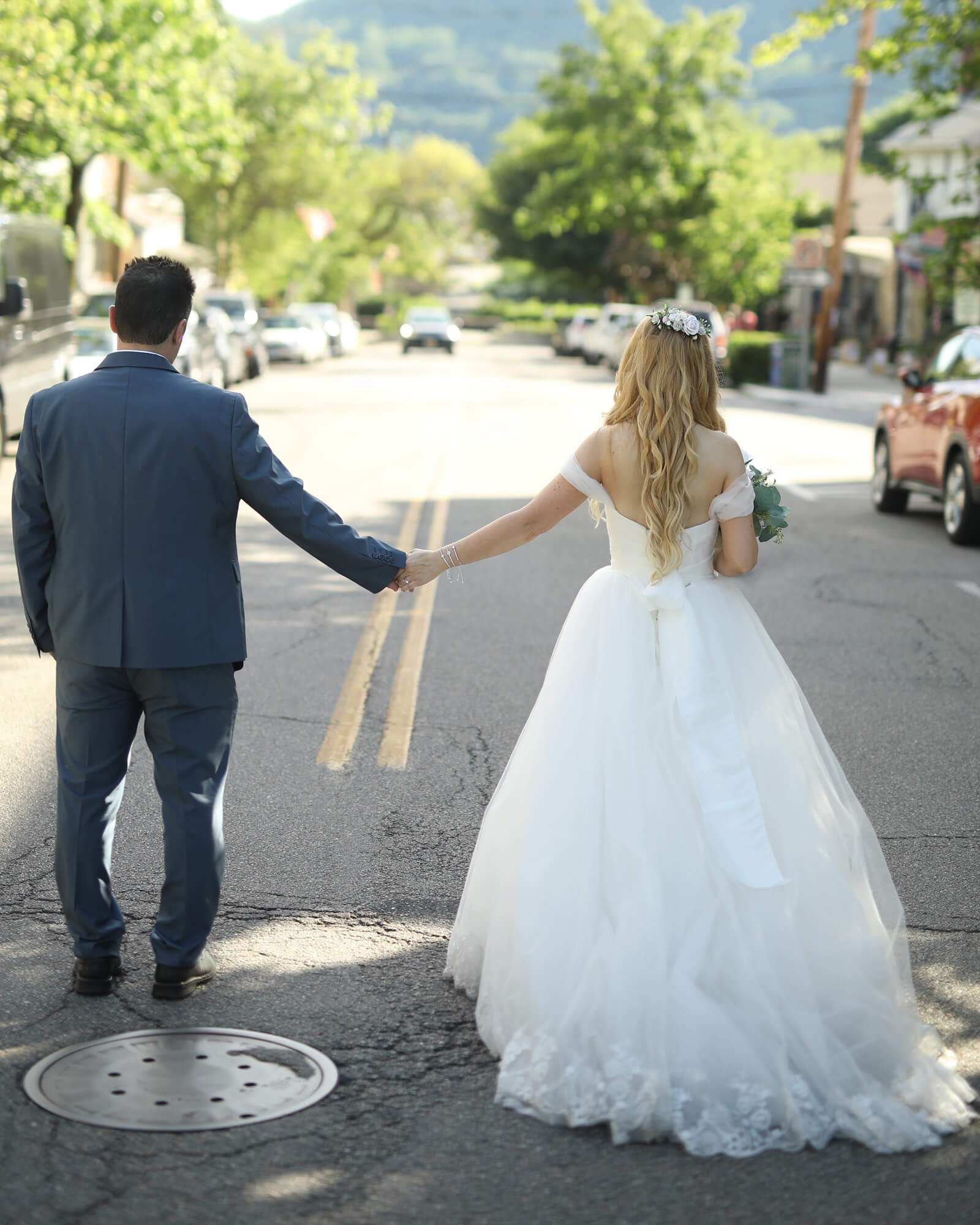 Holding hands and walk into the next chapter of your happiness together 