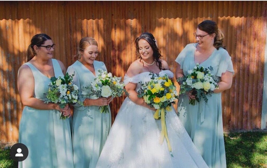 the bride and her bridesmaids. affordable A-line lace wedding dress. customized service available.