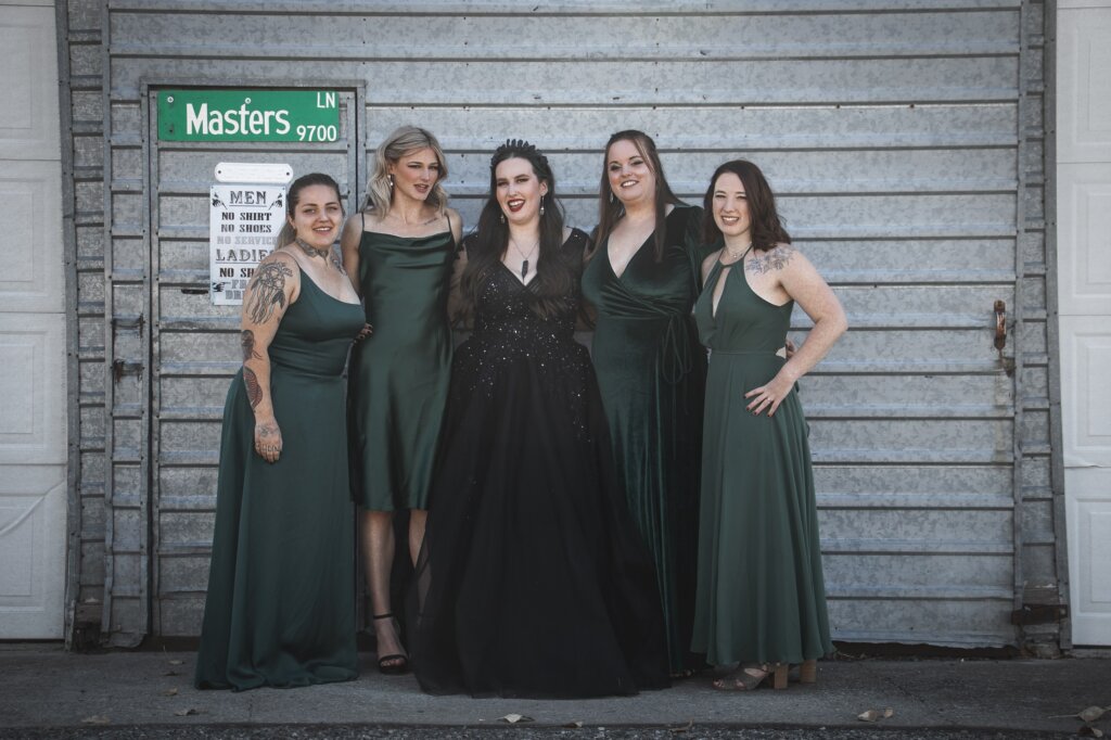 black wedding dress and satin bridesmaid dresses